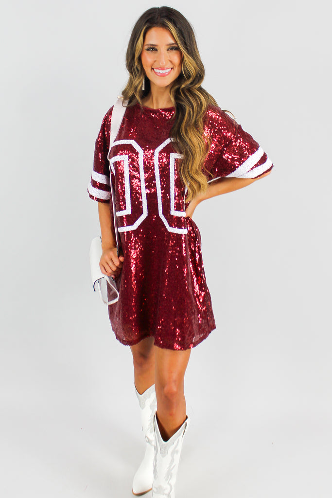 Burgundy short sleeve sequin gameday dress with white fouble zeros on the front