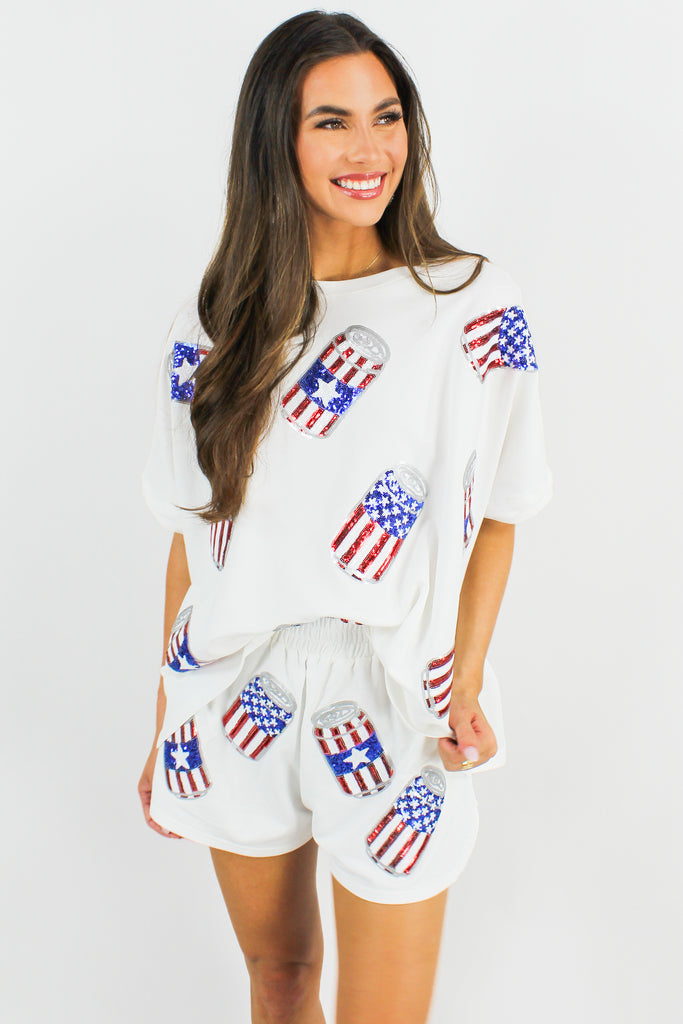 white cotton oversized tee with american flag sequin beer can patches