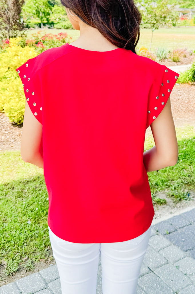 red tee with silver studded sleeves 