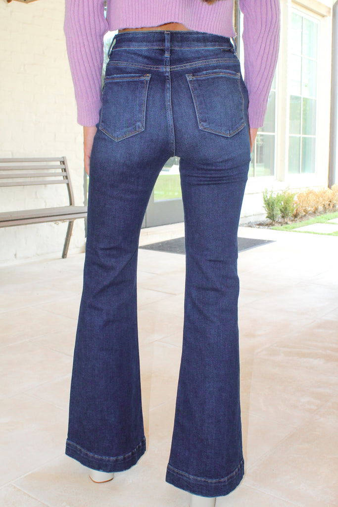 dark denim flare jeans with pockets on the outside