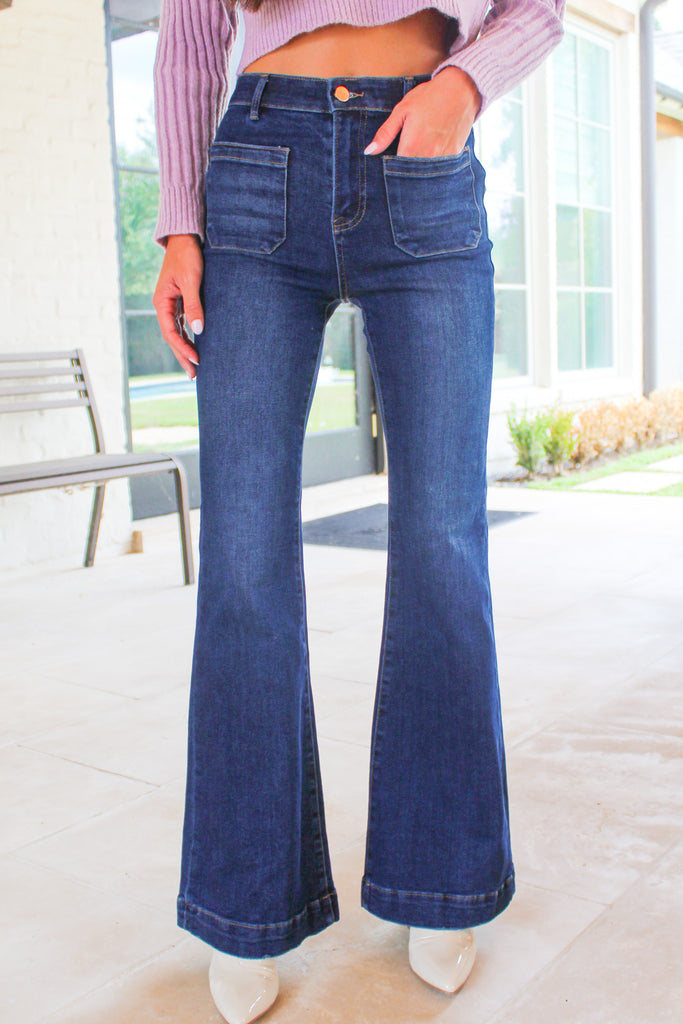 dark denim flare jeans with pockets on the outside