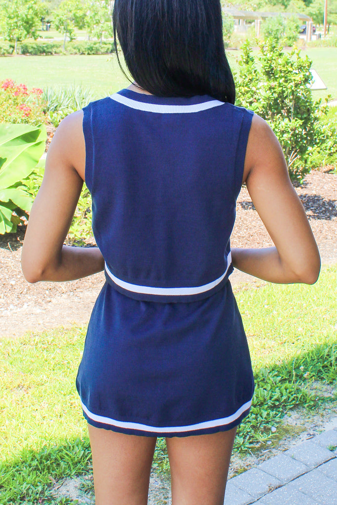 navy knit skirt and tank set with white trim edges