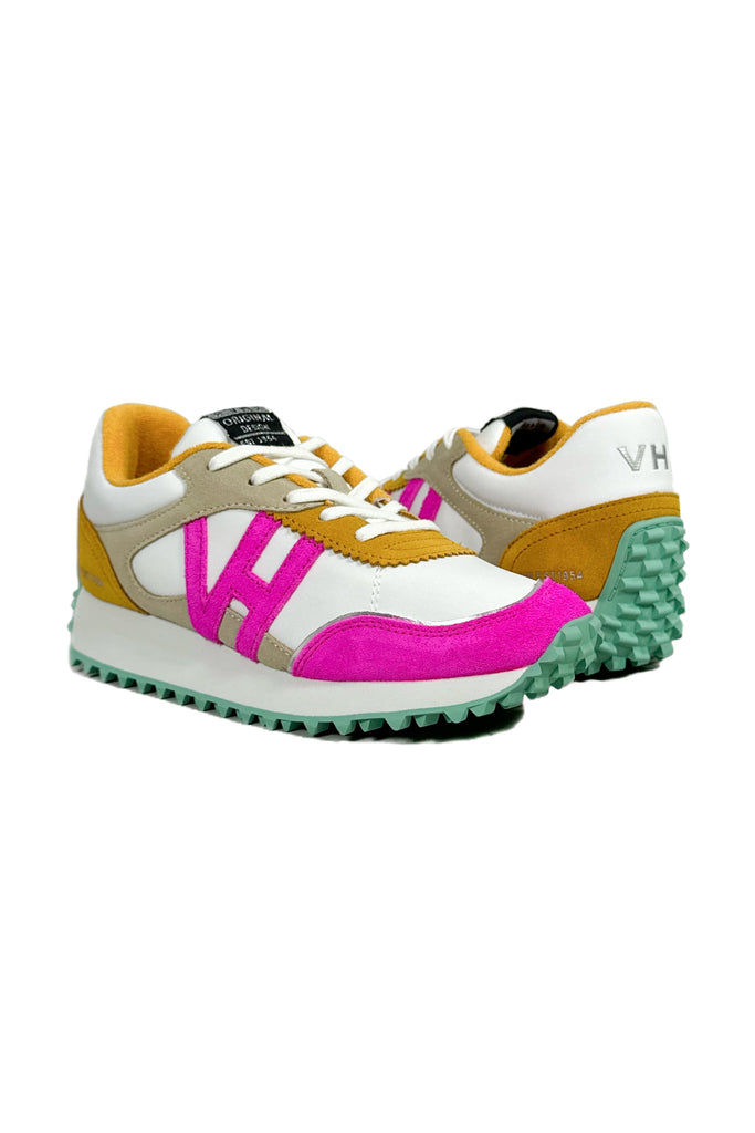 mixture of hot pink, mustard, and white color blocking on these chunky platform athletic trainers with a teal sole