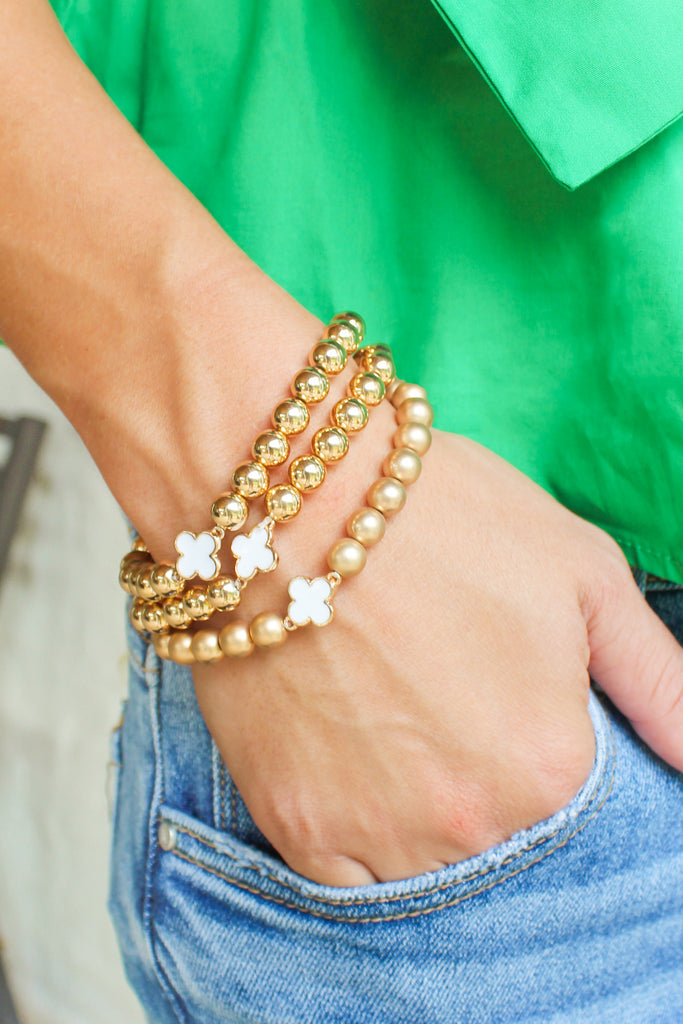 gold and white bracelet set 