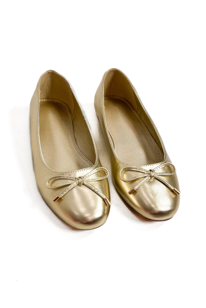 metallic gold ballet slip on flat with bow detail on front