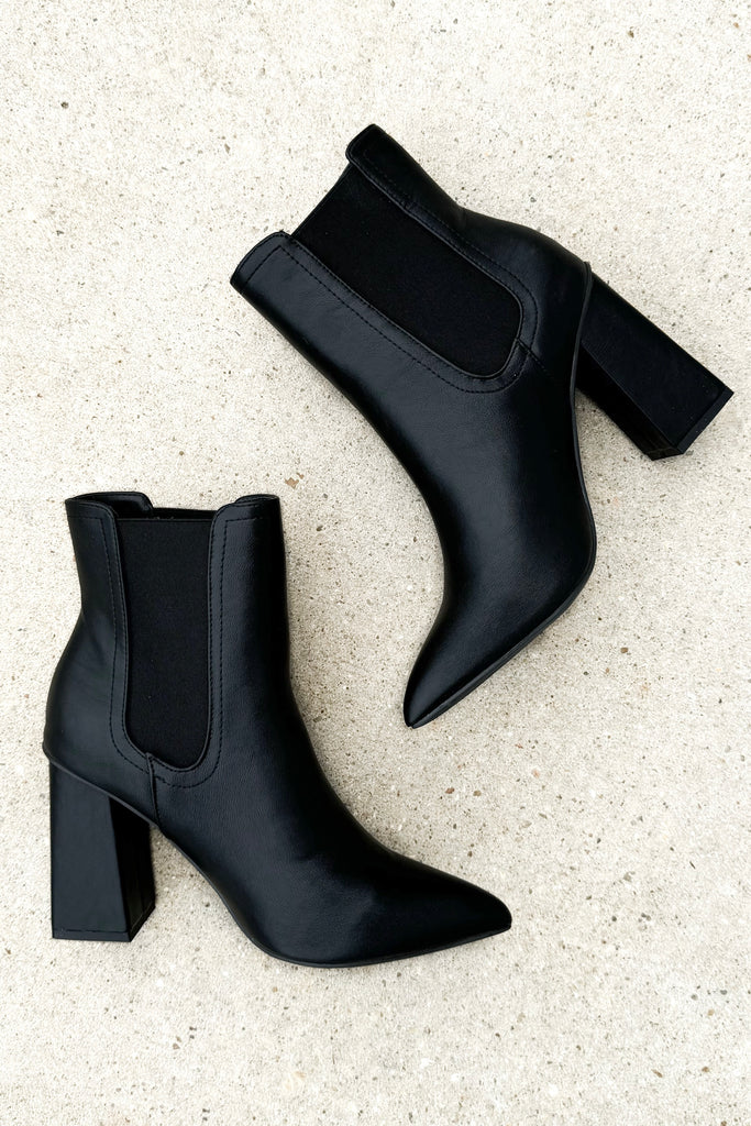 black pleather pointed toe ankle booties with a black stretchy contrast band