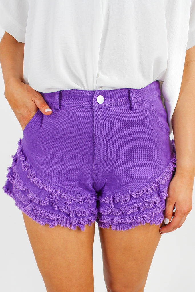 purple ruffle raw hem denim shorts