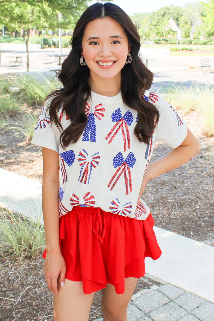 white top with red white and blue stars and stripes sequin bows by queen of sparkles