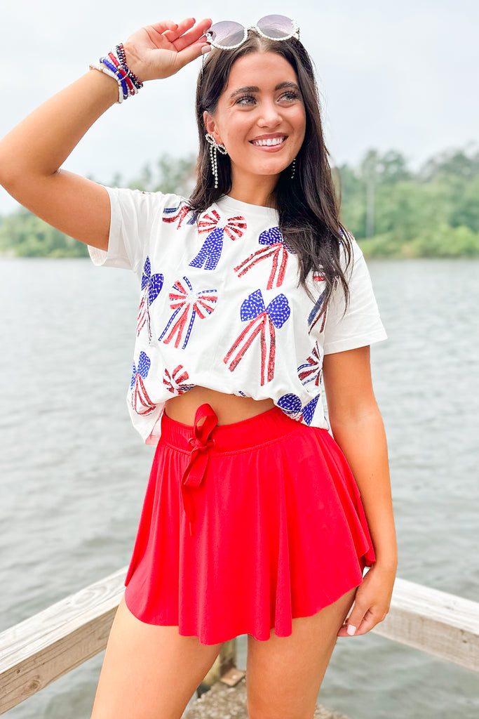 white top with red white and blue stars and stripes sequin bows by queen of sparkles