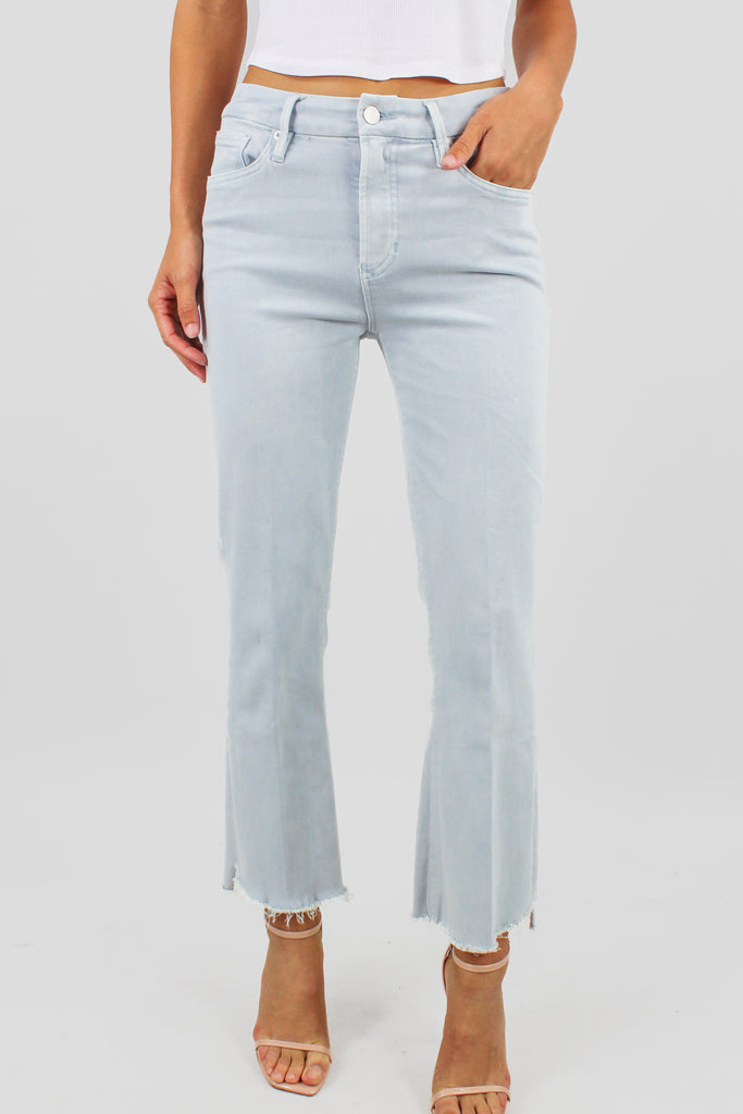 light denim cropped flare jeans with a distressed hem