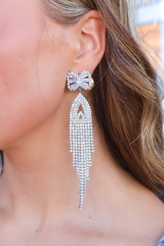 silver rhinestone bow tassel earrings